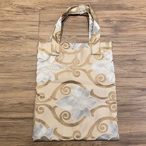 Free with purchase of $75 or more. Up cycled tote